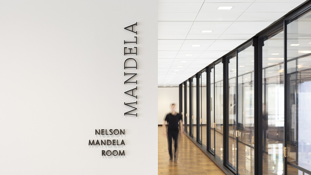 A person walking in a hallway.